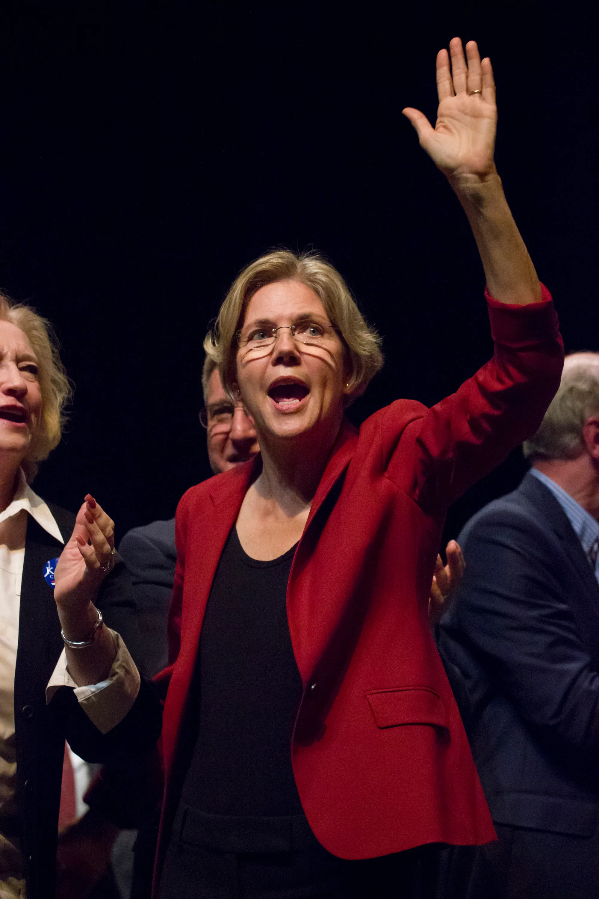 Politician Elizabeth Warren waves to voters on the campaign trail outside of Boston during her Senate run.